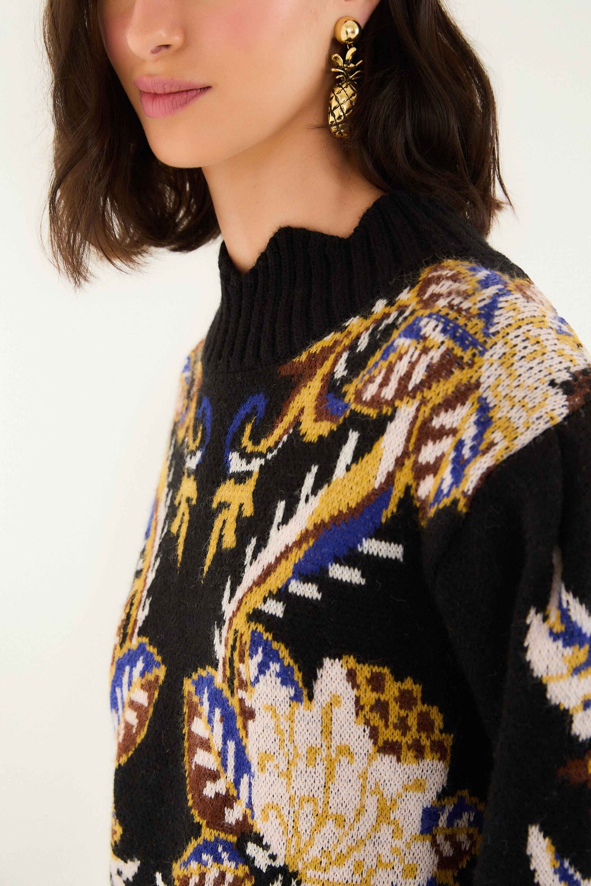 FARM Rio model wearing the Arabesque Paradise Knit Sweater