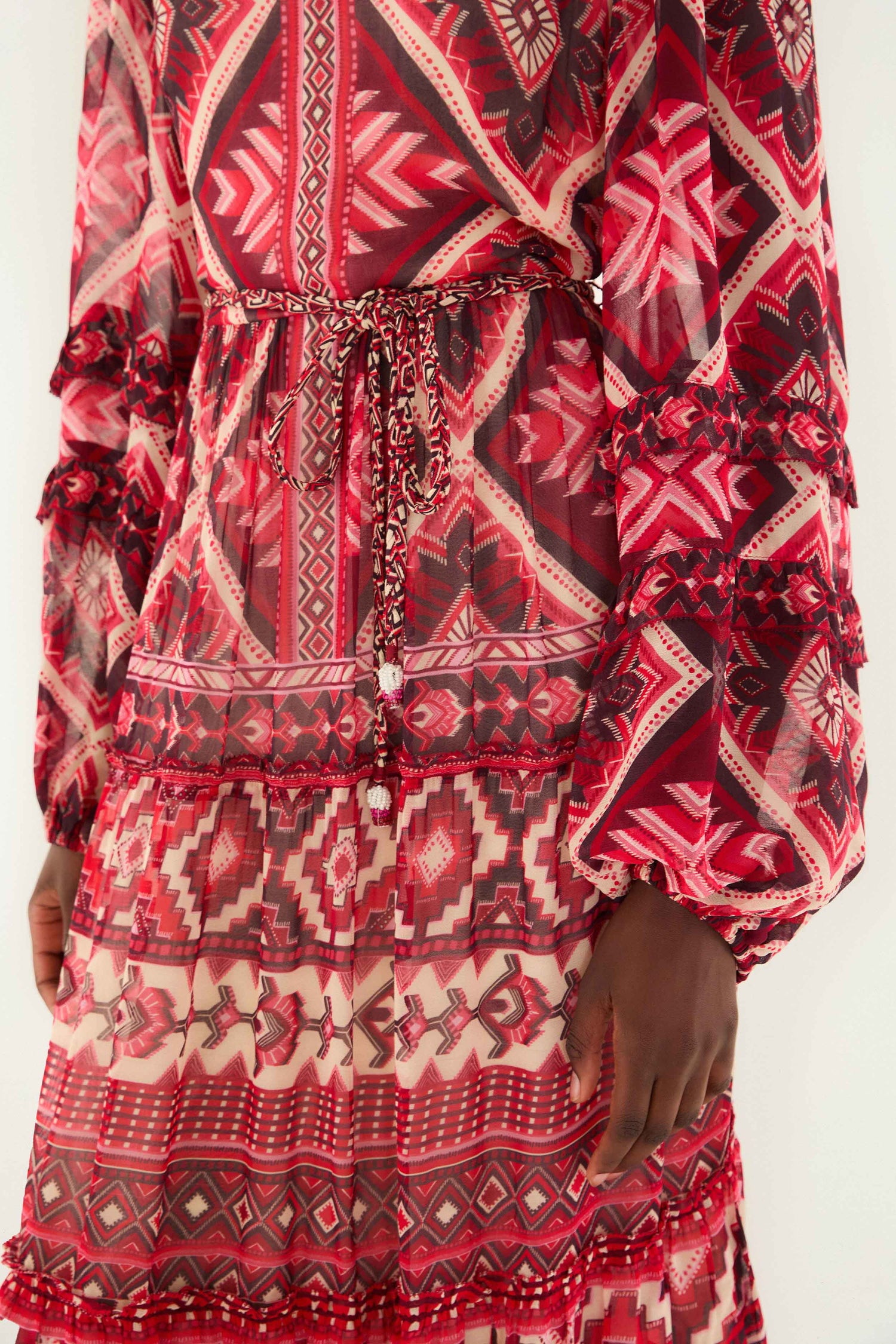 FARM Rio model wearing the Red Graphic Ainika Belted Tiered Maxi Dress